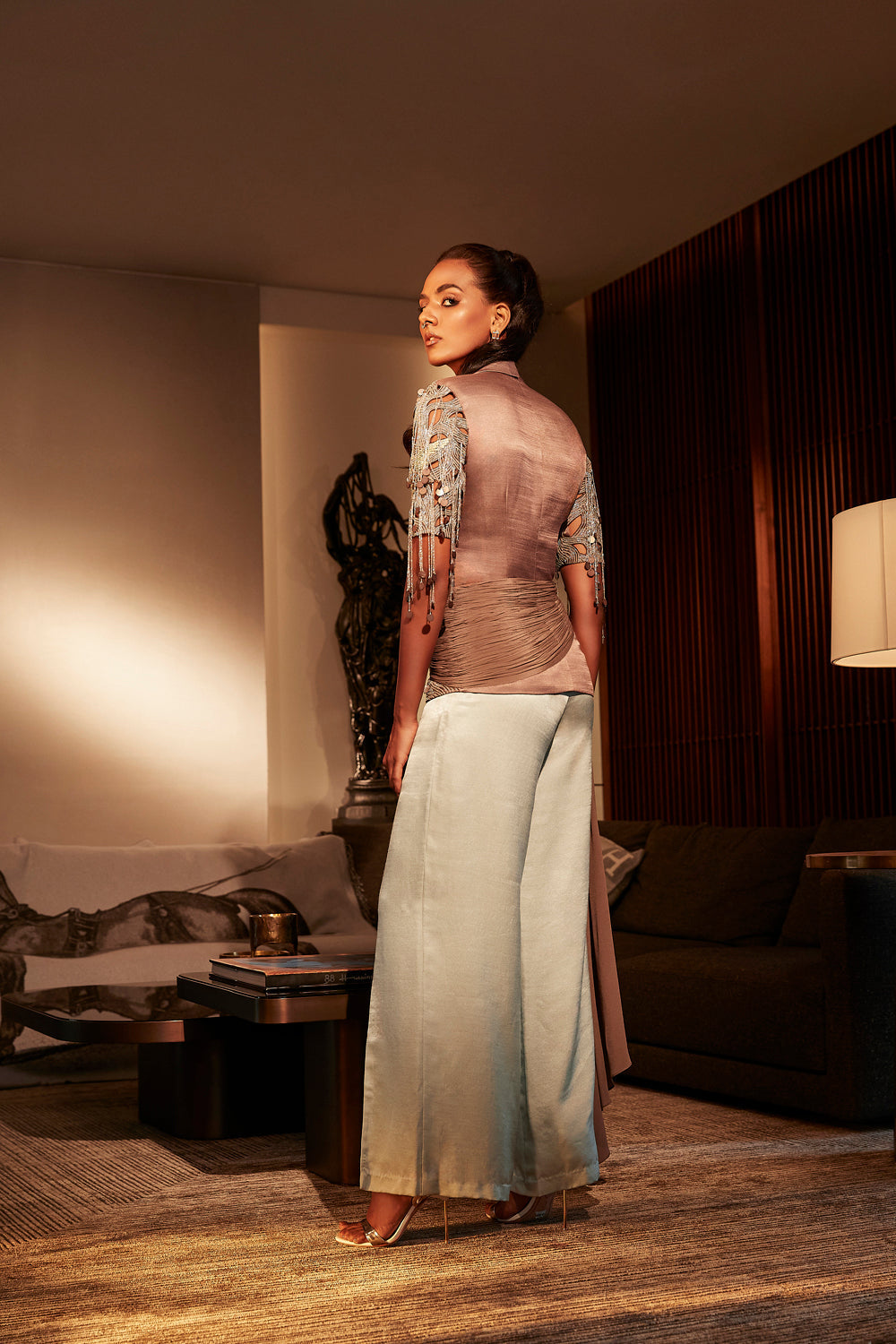 Espresso Structured Top With Cut-Work Embroidered Sleeves Teamed With Flared Pants.