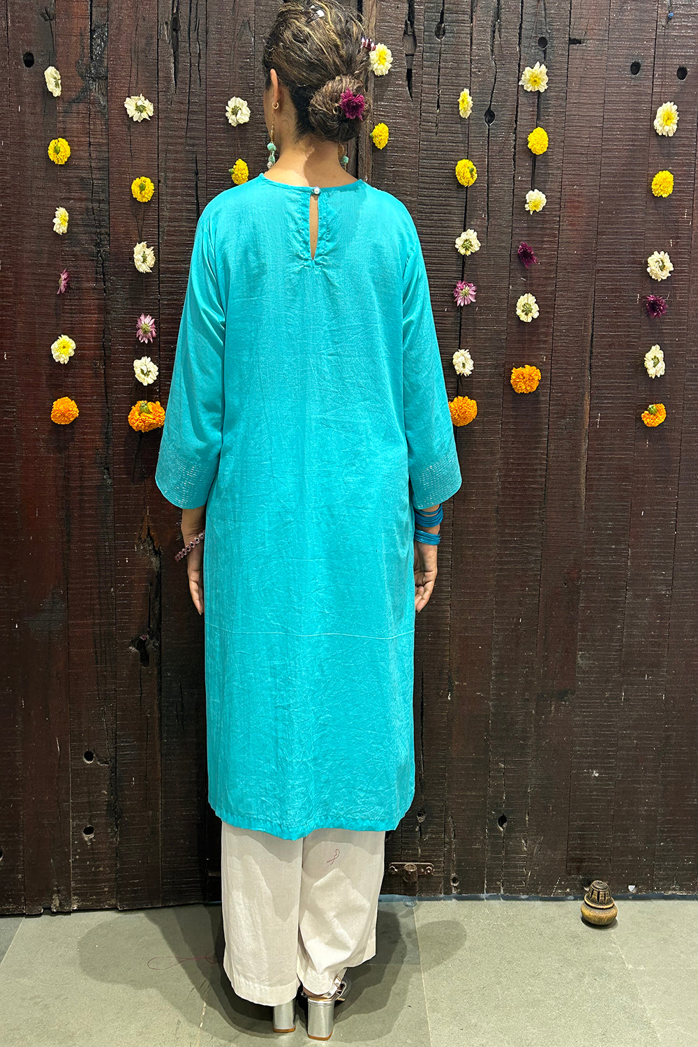 A Line Kurta In Mulmul With Handstitched Silver Thread Details.